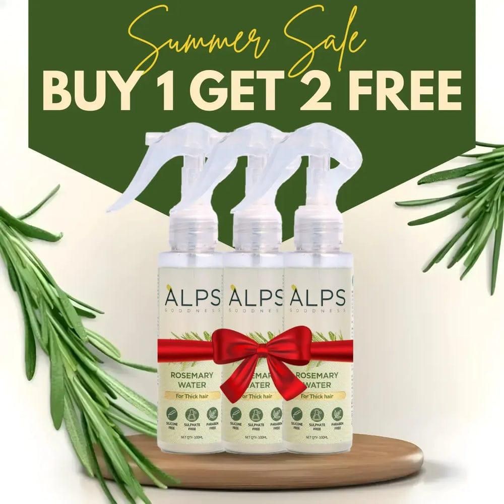 Three bottles of Alps Rosemary Water with a red bow on a wooden tray, surrounded by rosemary leaves, with 'Summer Sale Buy 1 Get 2 Free' text.